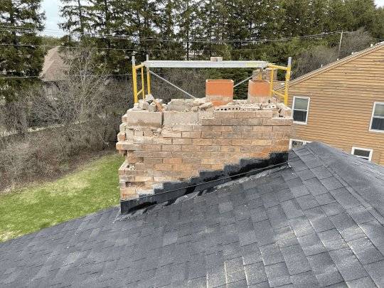 After photo: mortar joints tuckpointed on brick wall